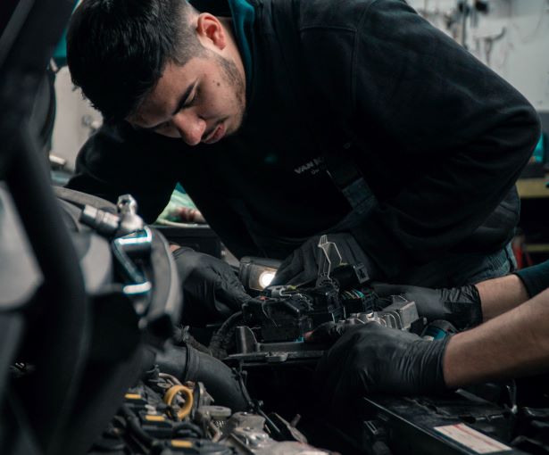 Man checking his car engine