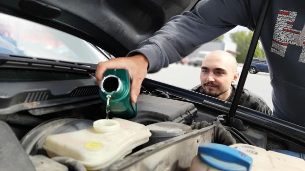 Is your car using too much oil? Car oil being refilled