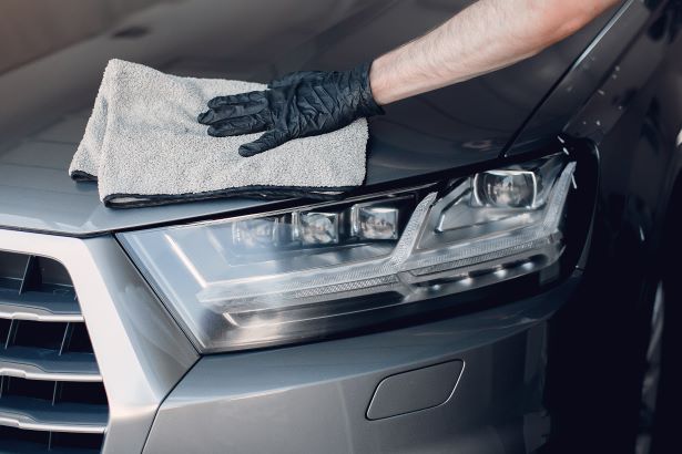 Why Waxing Your Car Is Important Car Hood Being Waxed